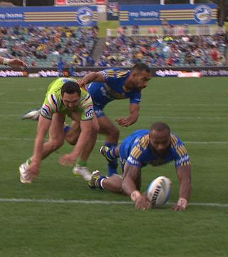 Rugby league player (potentially) grounding the ball in the in-goal area.